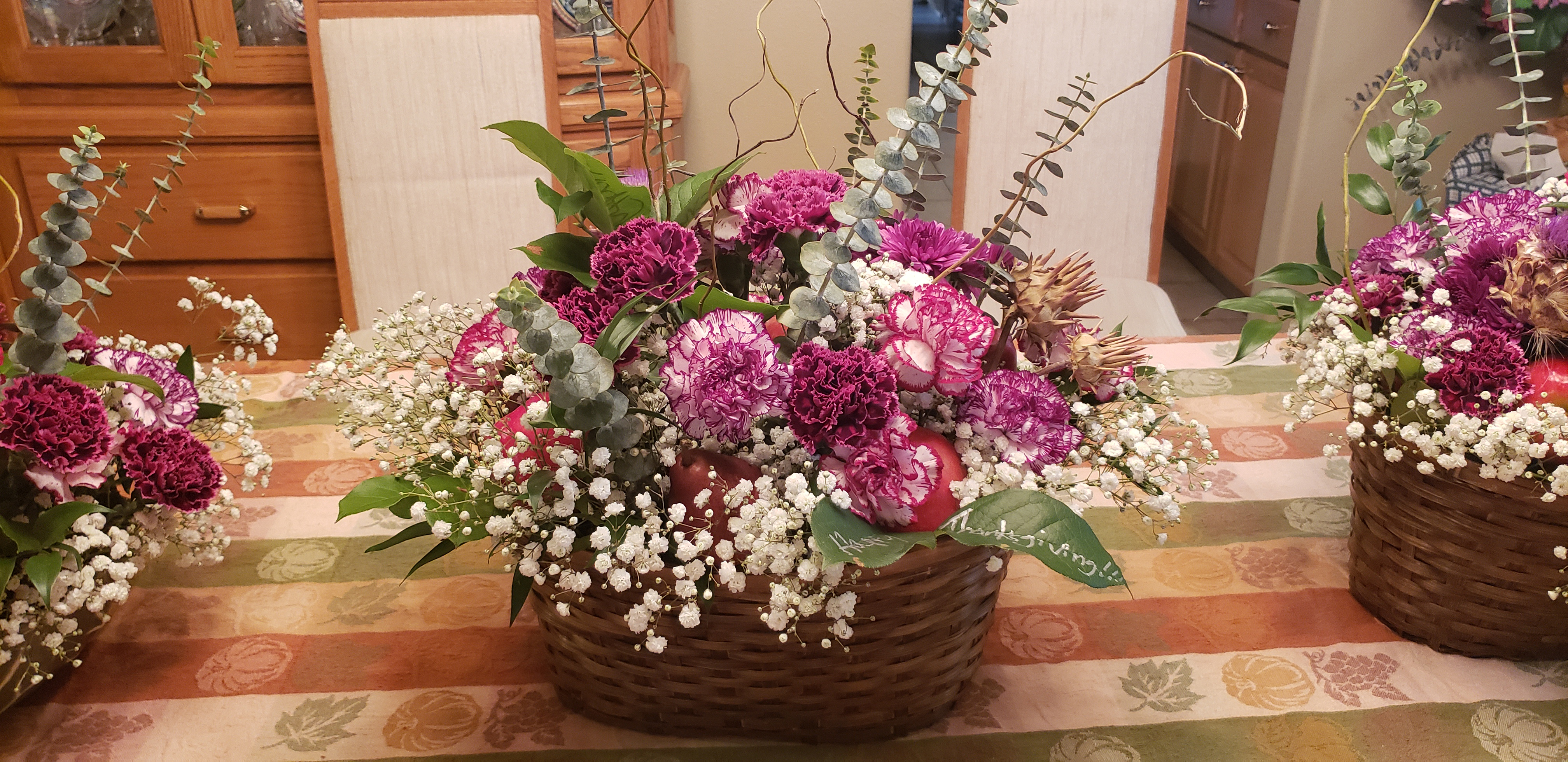 <strong>Thanksgiving Centerpieces</strong>: Magenta-tinged Carnation, Salal, Maroon Mums, White Gyp, Italian Ruscus, Baby Blue Eucalyptus, Curly Willow, Honeycrisp Apple, Dried Thistles, & D'Anjou Pear